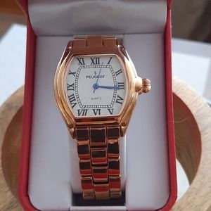 Peugeot rose gold tone watch